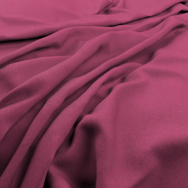 Deep magenta fabric gathered into broad, softly lustrous folds