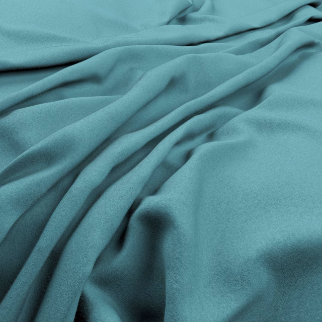 Smooth Pacific teal fabric draped in folds, with aqua highlights and deep blue-green shadows