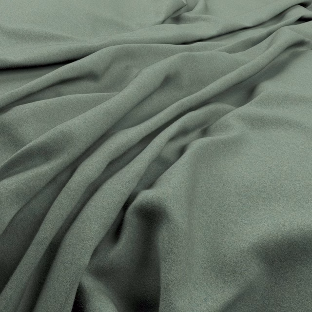 Muted seaglass green plain fabric falling in soft, shadowed folds