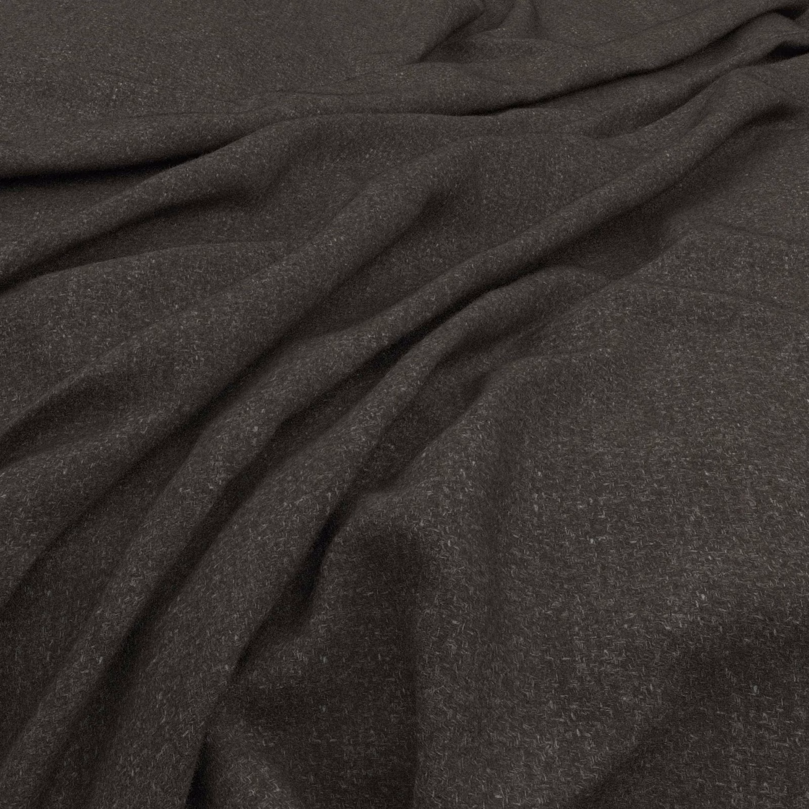 Deep charcoal fabric with a softly mottled surface gathered into fluid folds