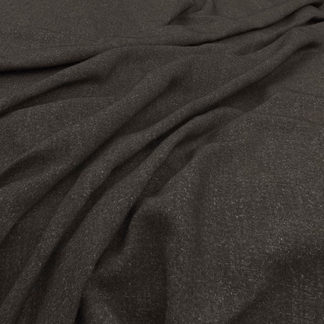 Deep charcoal fabric with a softly mottled surface gathered into fluid folds