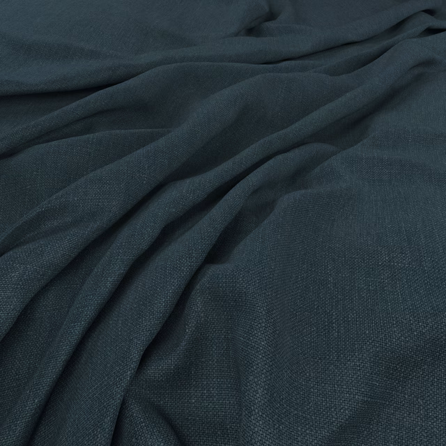 Deep ink-teal plain weave fabric draped in softly gathered, textured folds
