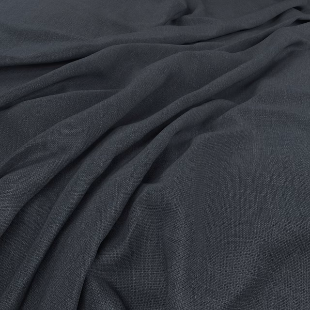 Deep blue-grey fine weave fabric gathered into soft, fluid folds