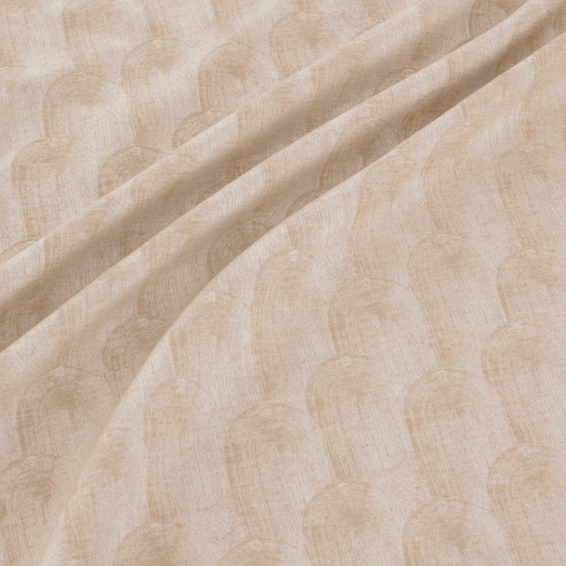 Warm natural beige fabric with tonal arch motifs and fine woven texture