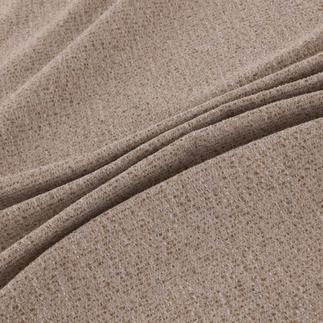 Warm husk beige woven fabric with fine nubs and folded ridges
