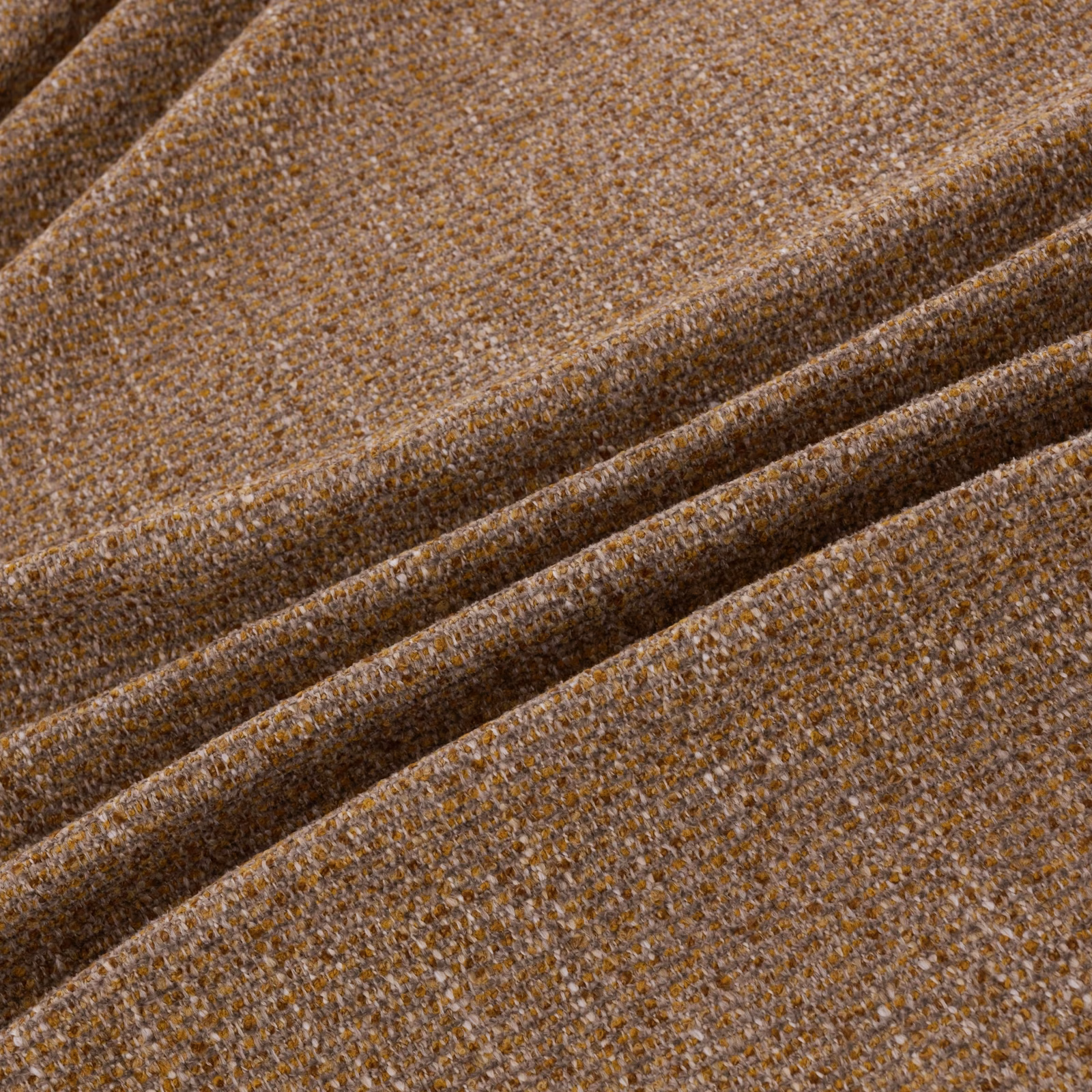 Warm sienna-brown textile with fine flecked weave and softly folded surface
