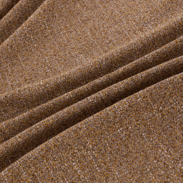 Warm sienna-brown textile with fine flecked weave and softly folded surface