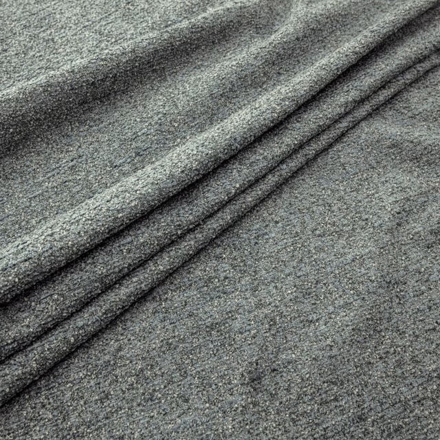 Muted seafoam-grey nubby weave gathered into soft diagonal folds