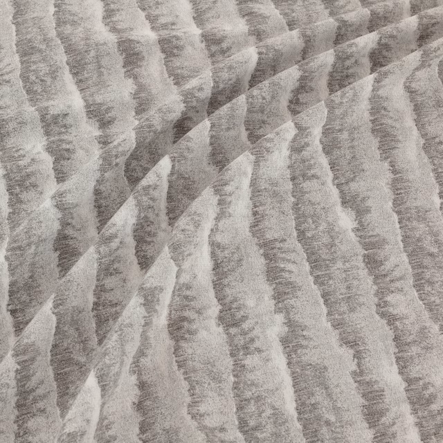 Silver-grey textile with irregular diagonal graphite bands and a softly brushed surface