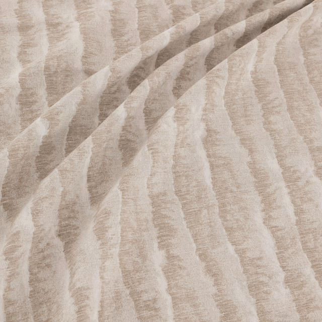 Greige fabric with irregular vertical bands and softly textured woven surface