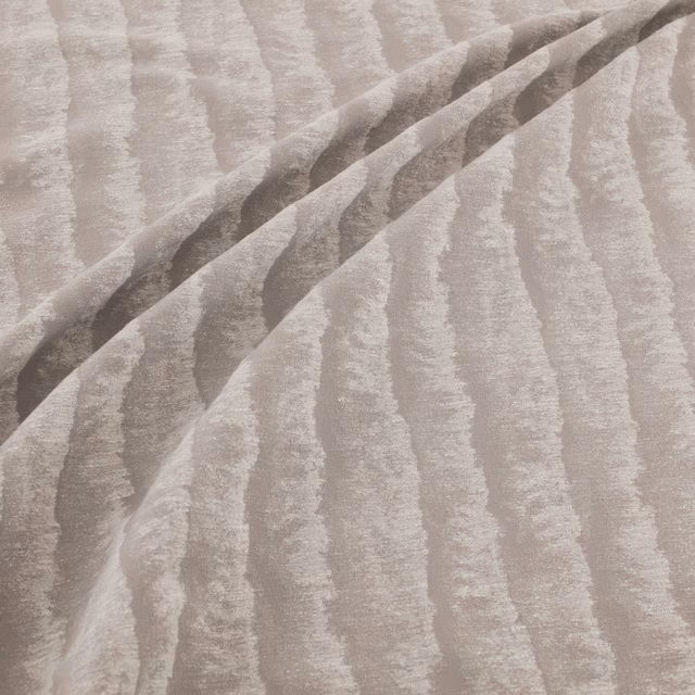 Pale titanium-grey fabric with irregular vertical striations and softly lustrous texture