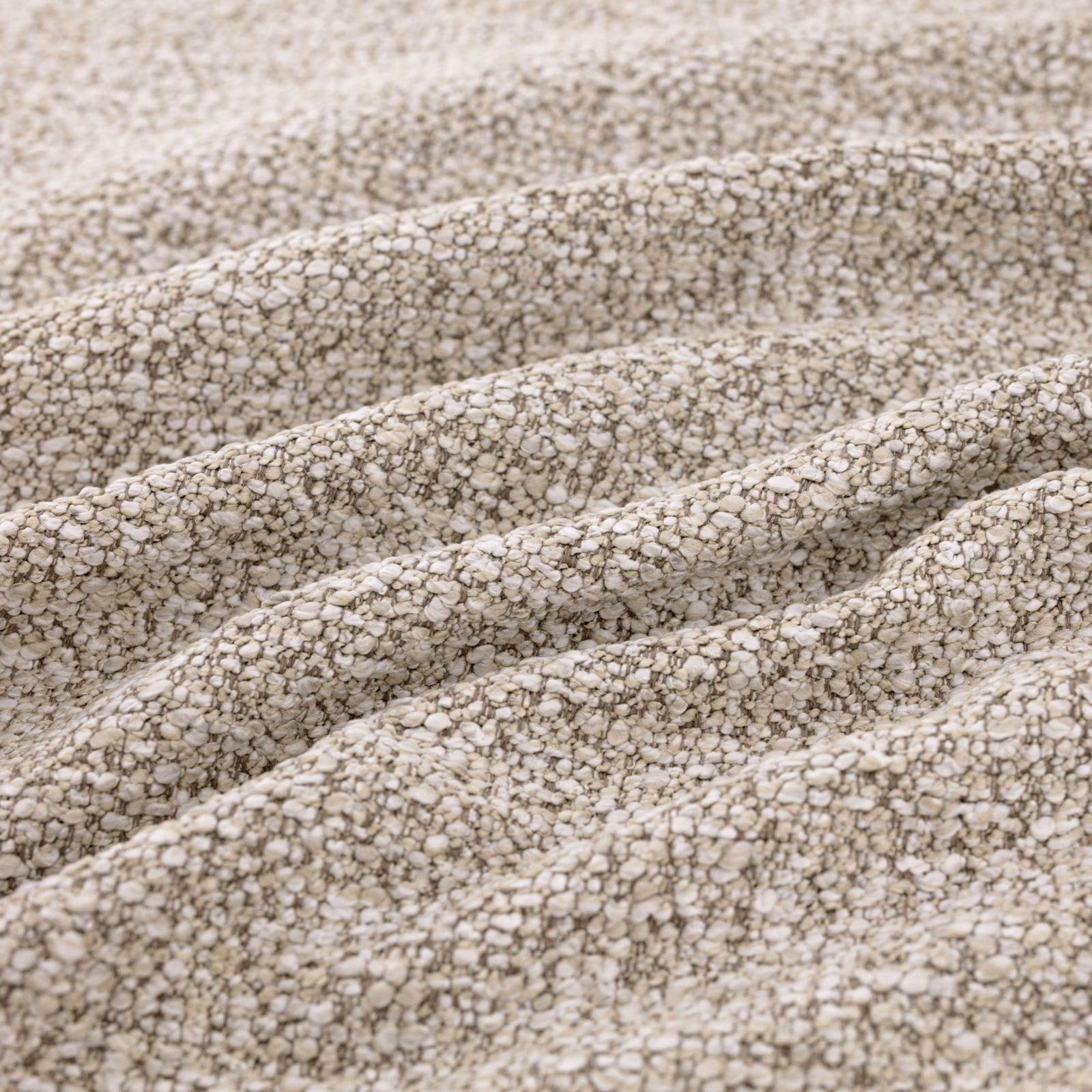 Warm biscuit looped weave with cream texture and taupe flecks in folded ridges