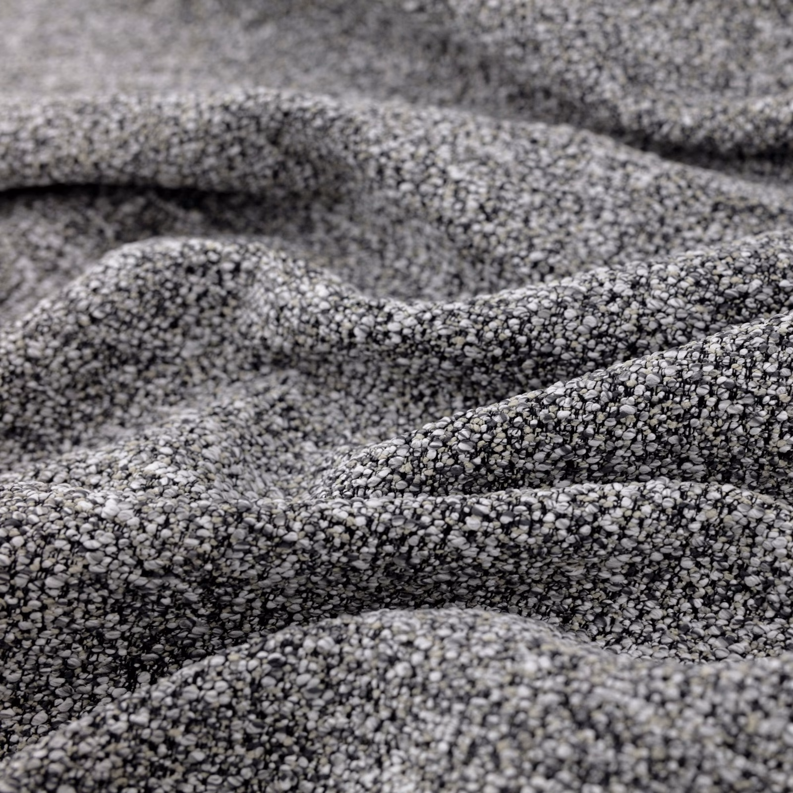 Close-up of graphite-grey nubby weave with charcoal and silver flecks