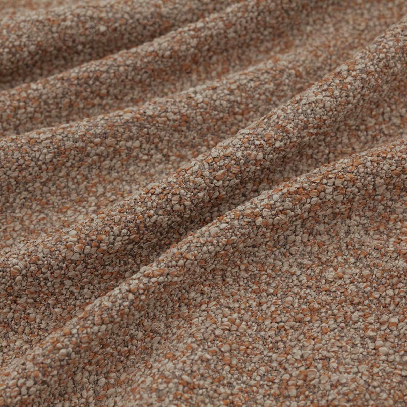 Close-up of Atlas Kiln’s nubby brown weave with terracotta and pale flecks