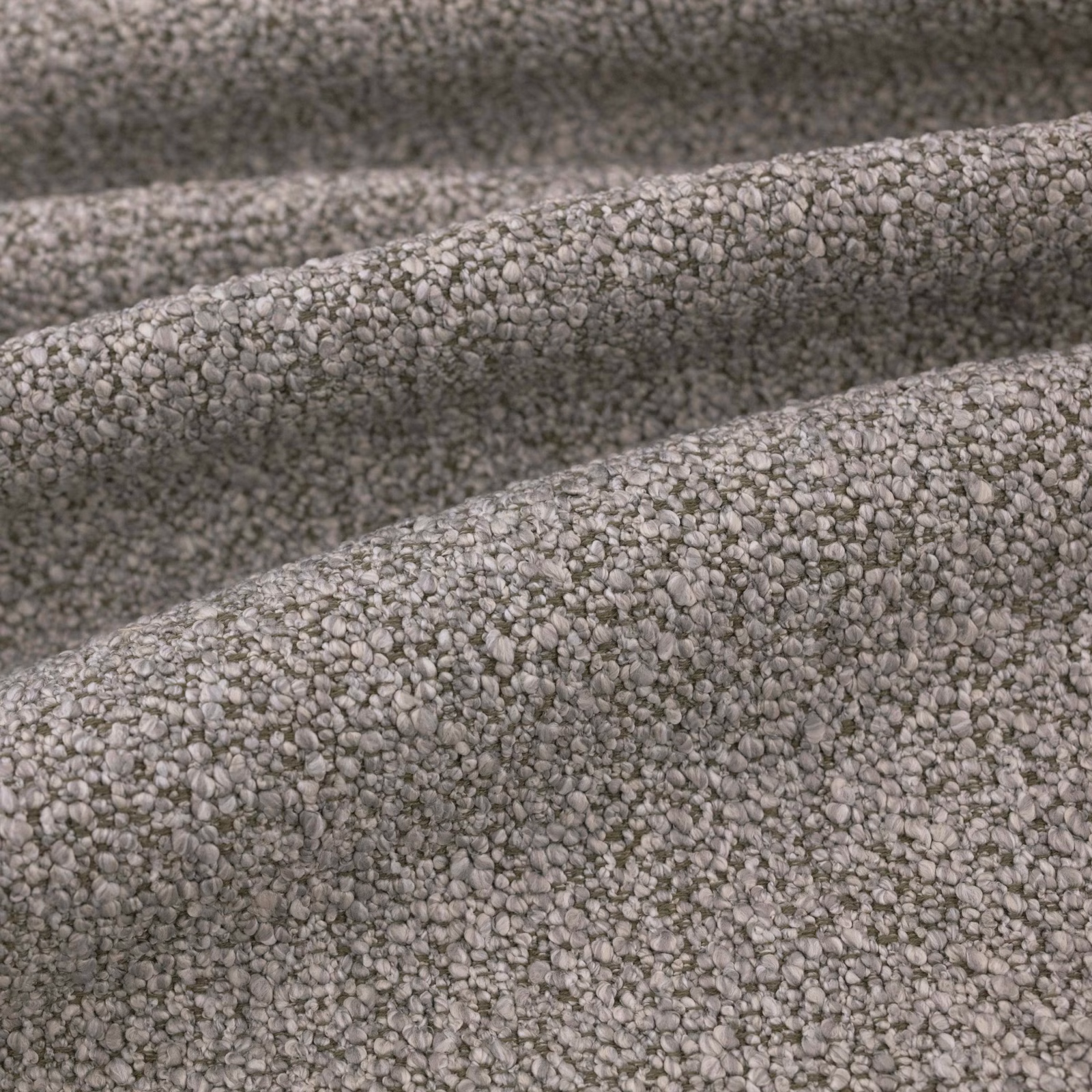 Close-up of cool grey Atlas fabric with dense pebble-textured woven surface