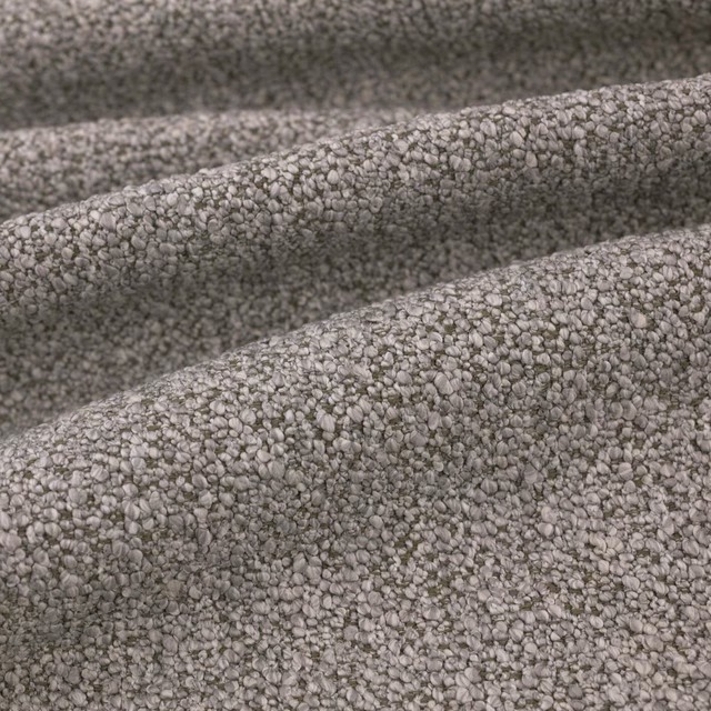 Close-up of cool grey Atlas fabric with dense pebble-textured woven surface