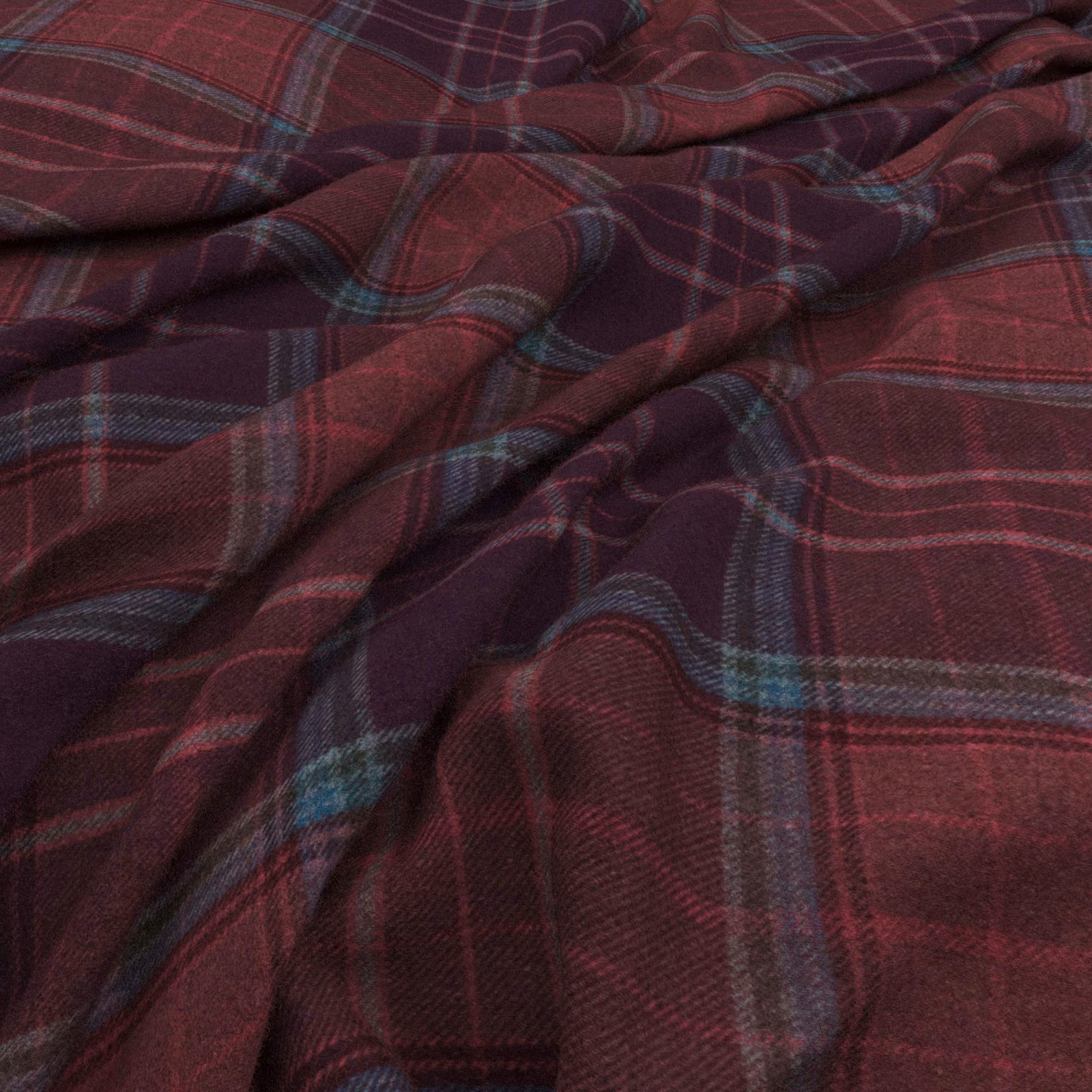 Deep plum burgundy plaid fabric with muted teal lines and softly brushed woven texture