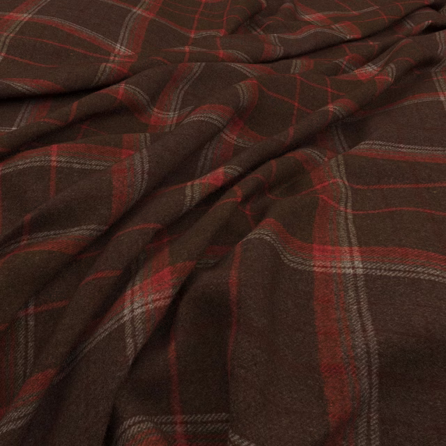 Deep brown checked fabric with madder-red and grey woven lines in soft folds