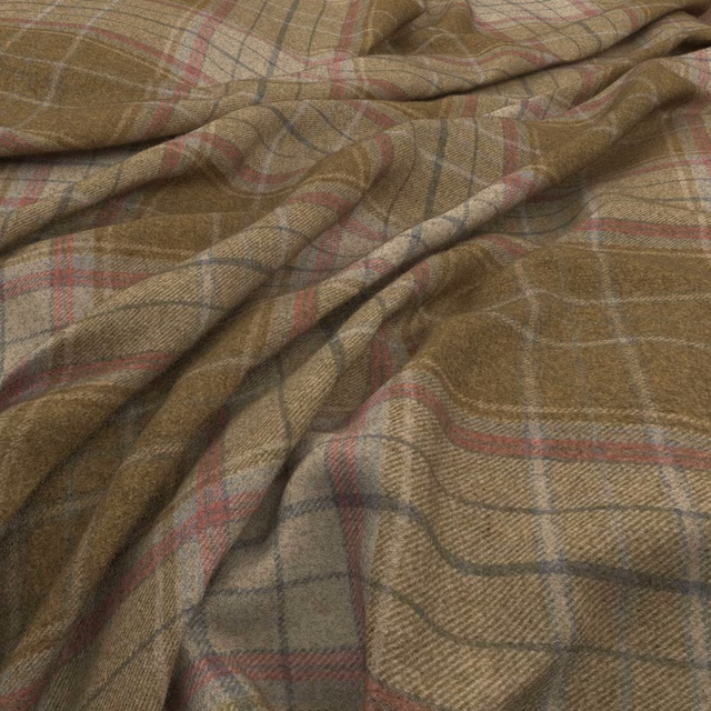 Muted brown taupe plaid with blush red and charcoal lines in a folded woven textile