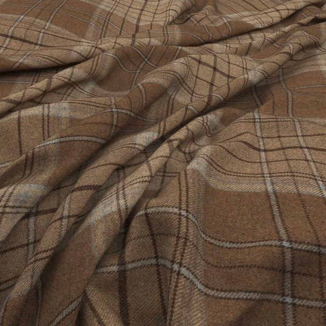 Warm tan-brown woven plaid with dark brown and muted grey lines in soft folds