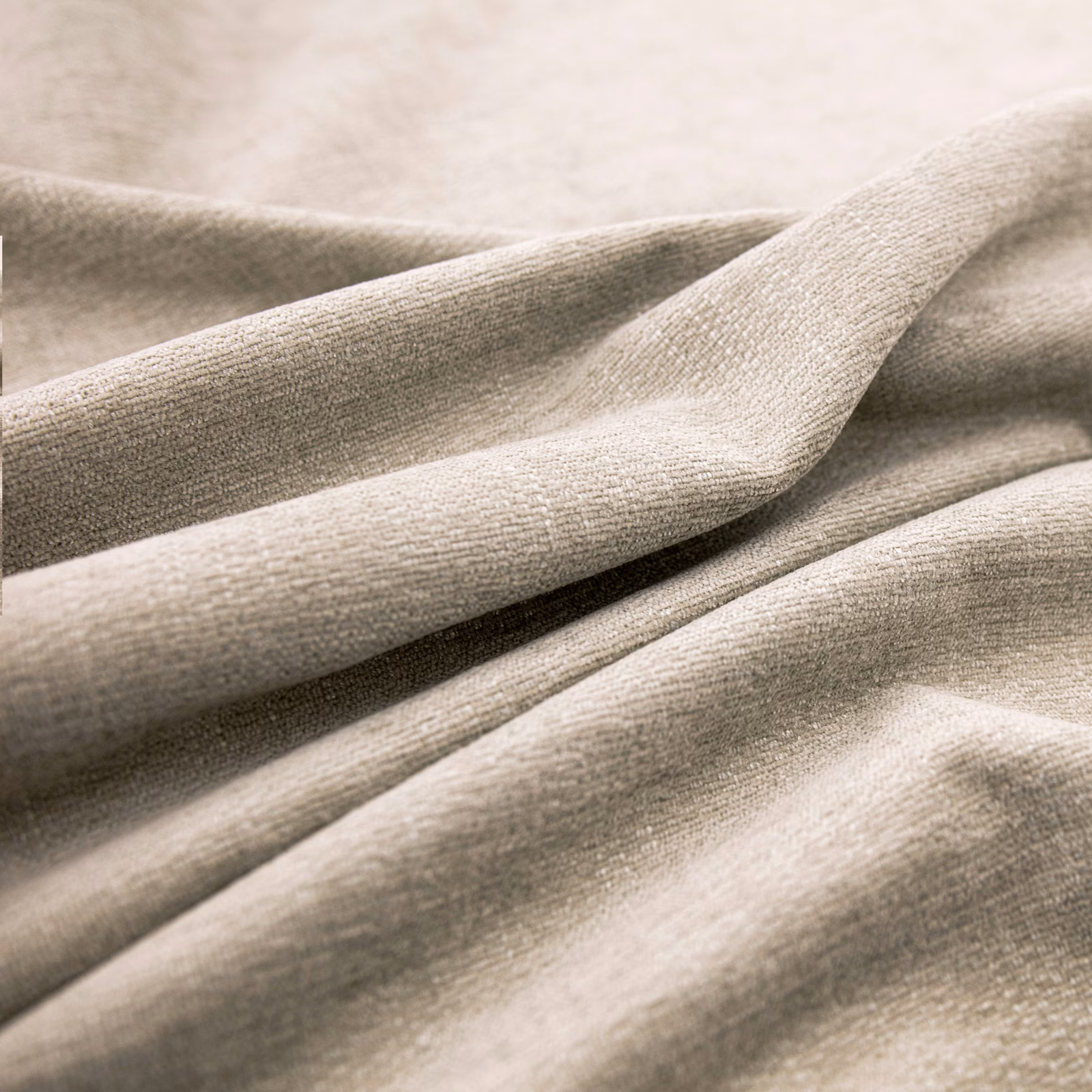 Warm pale taupe woven fabric draped in softly shadowed folds