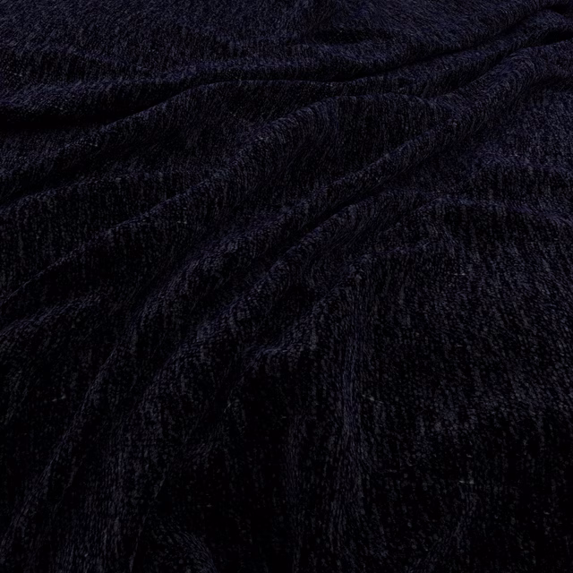 Deep midnight-blue plush fabric with directional pile and subtle navy highlights in folds