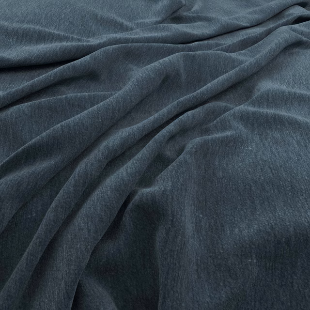 Deep Prussian blue upholstery fabric with a soft napped texture in fluid folds