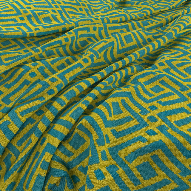 Teal and chartreuse woven fabric with an irregular maze-like geometric motif