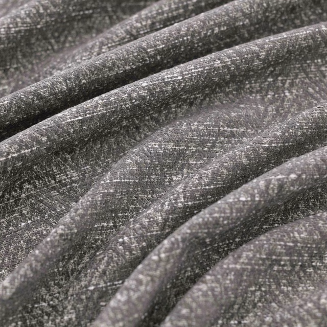 Shadow-grey woven fabric with charcoal flecks and softly ridged folds