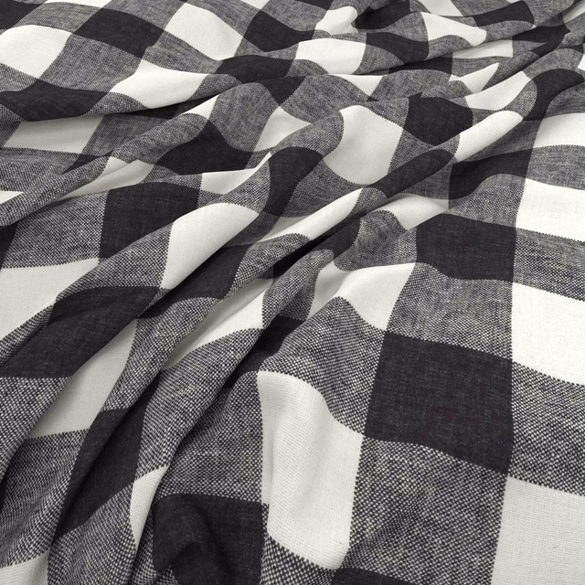 Charcoal, grey and white geometric check with a fine woven texture in soft folds