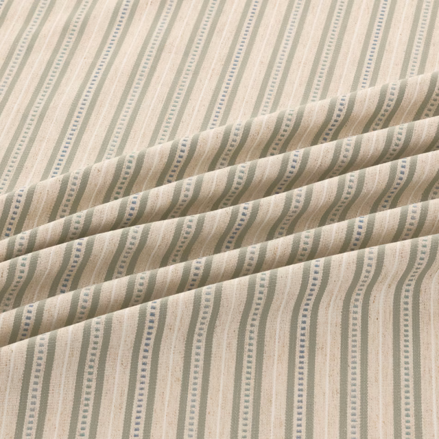 Cream and beige wavy vertical stripes with muted sage-grey dotted accents in woven texture