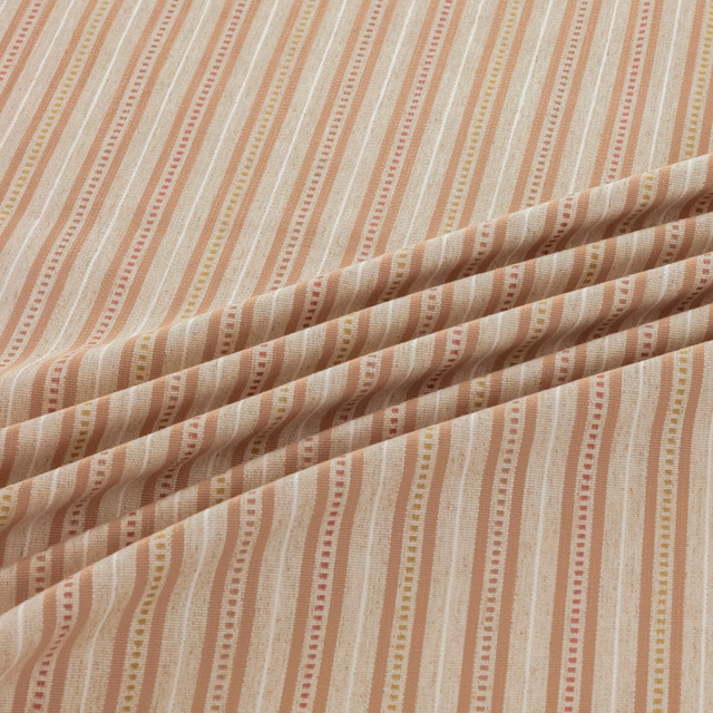 Warm cream woven fabric with dusty terracotta and beige pinstripes, folded