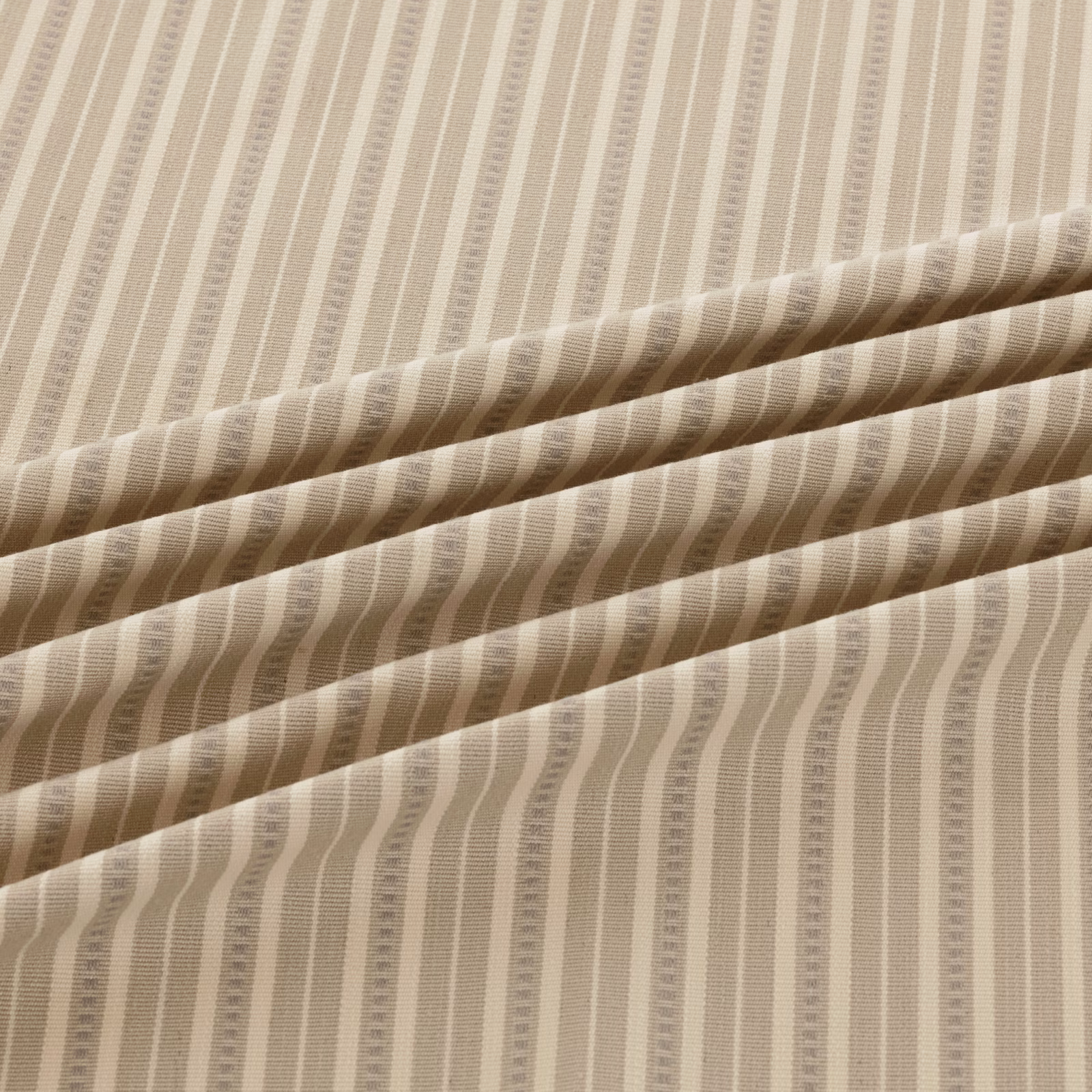 Pale taupe and ivory fabric with softly wavering vertical ribbed stripes