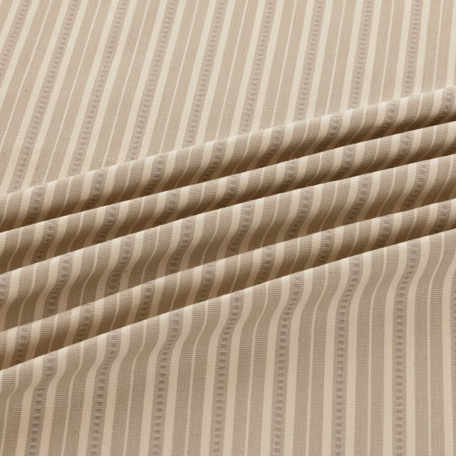 Pale taupe and ivory fabric with softly wavering vertical ribbed stripes