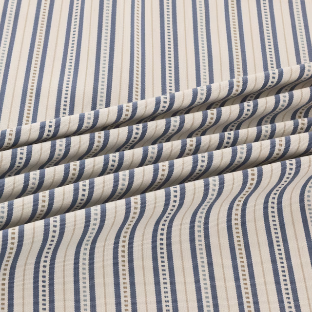 Cream and navy woven stripes with dotted bands shown in a folded swatch