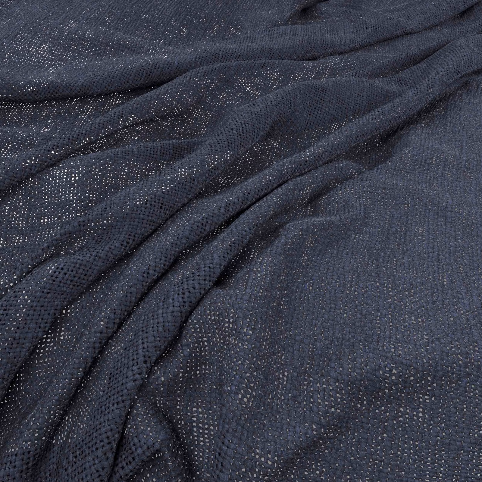 Deep ink-blue fabric with fine open weave gathered into softly shaded folds
