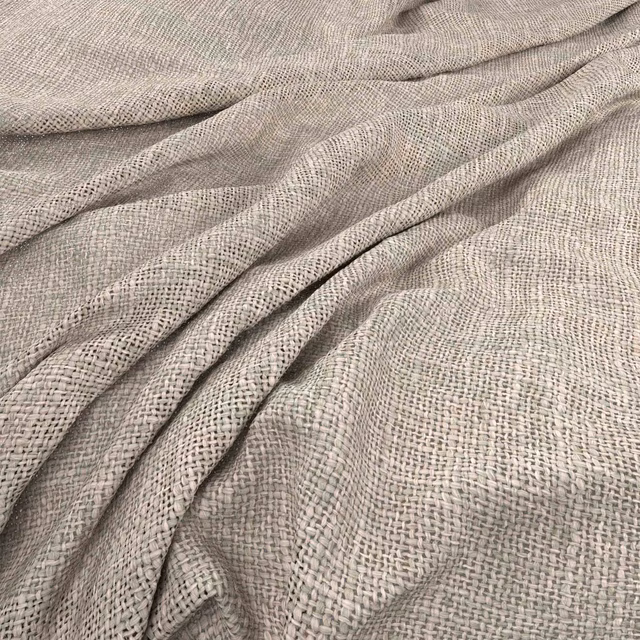Pale oyster taupe fabric with a fine irregular basket weave in soft folds