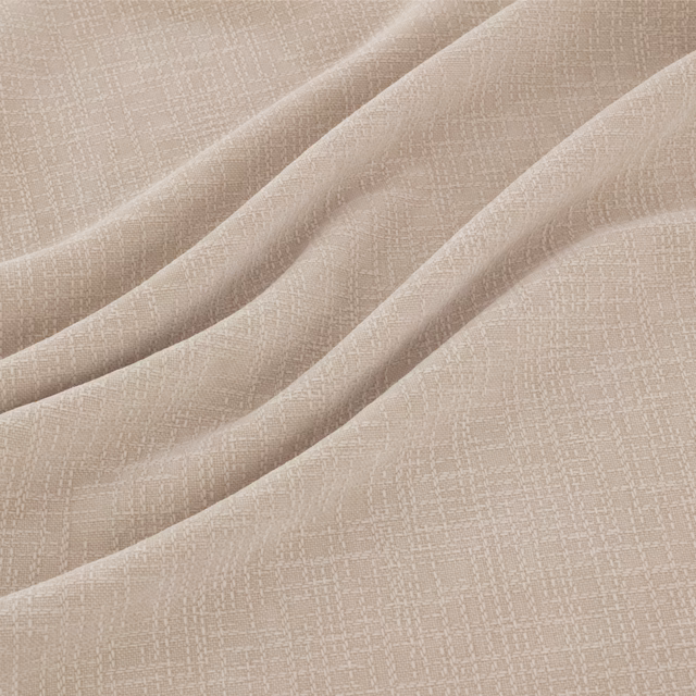 Warm ivory fabric with a fine woven crosshatch, draped in soft folds