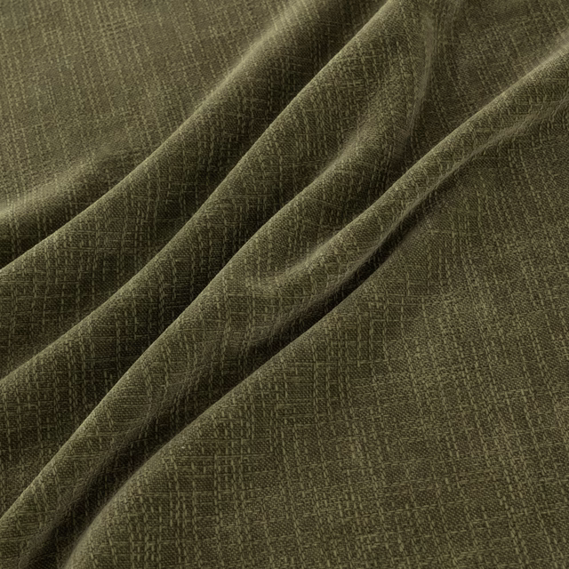Deep moss-green woven fabric with fine crosshatch texture arranged in soft folds
