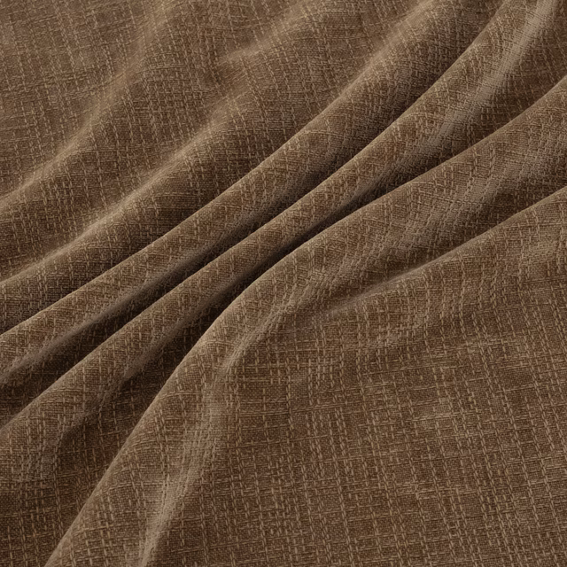 Warm sorrel-brown woven fabric with fine crosshatch texture in softly folded drape