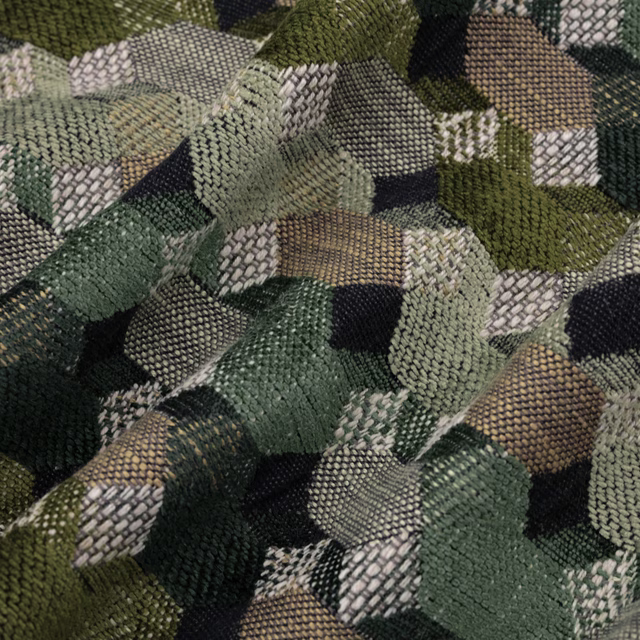 Close-up of Cabaret Vermillion geometric upholstery in olive, sage and charcoal woven texture.