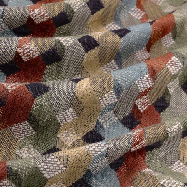 Multicolour geometric upholstery fabric with muted blue, green, terracotta and navy woven texture