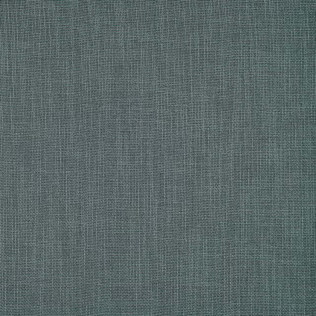 Close-up of a muted kingfisher teal plain-woven fabric with fine texture