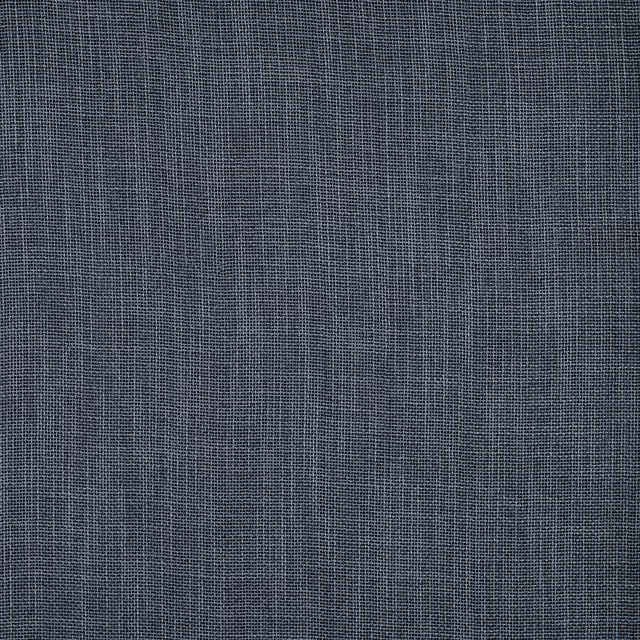 Close-up of slate blue plain-woven fabric with a fine textured grid