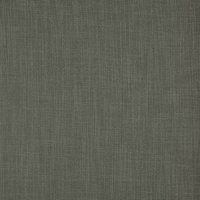 Close-up of plain muted sage olive fabric with a fine woven texture