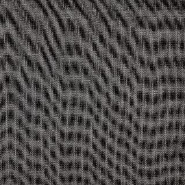 Close-up of a smoky charcoal grey plain woven fabric with fine texture
