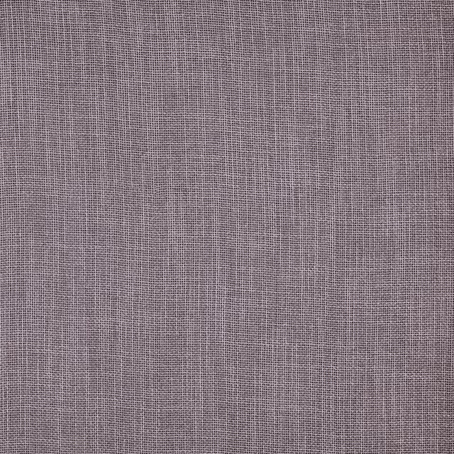 Close-up of a soft wisteria lilac plain weave fabric with fine texture