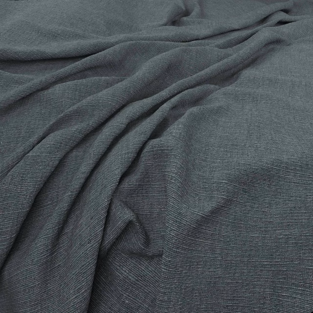 Deep slate blue-grey woven fabric with fine horizontal texture in fluid folds