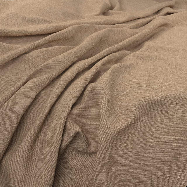 Warm biscuit-taupe fabric showing fine horizontal ribbing in soft folds