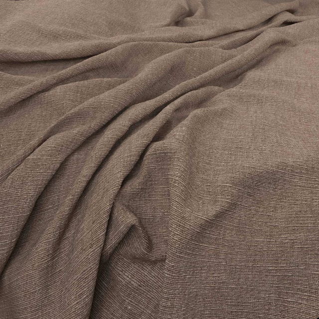 Warm taupe woven fabric with fine horizontal texture, softly gathered into folds